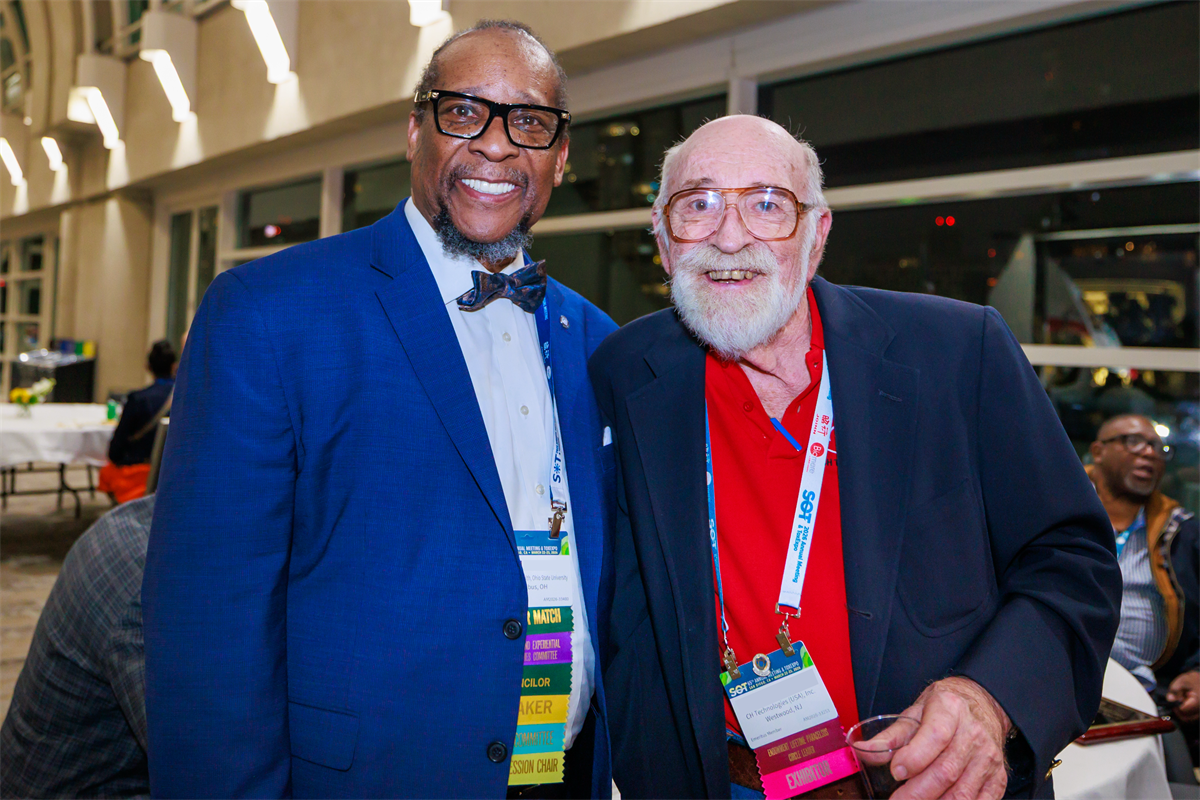 Two SOT members smiling at the camera.